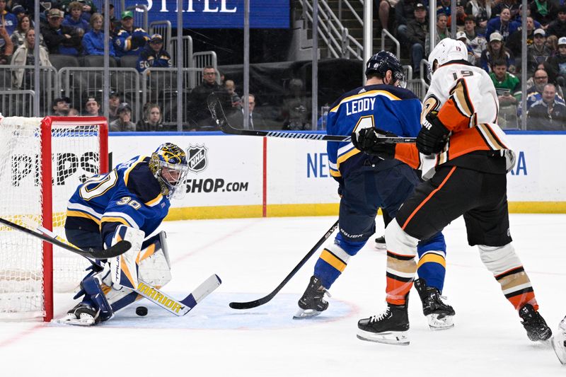 Mar 17, 2024; St. Louis, Missouri, USA; Anaheim Ducks right wing Troy Terry (19) scores a goal against St. Louis Blues goaltender Joel Hofer (30) during the first period at Enterprise Center. Mandatory Credit: Jeff Le-USA TODAY Sports