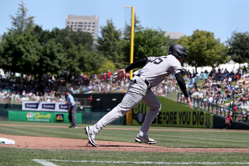 May 10, 2025; West Sacramento, California, USA; New York Yankees right fielder Cody Bellinger (35) tags up from third base on a sacrifice fly from Austin Wells (not pictured) against the Athletics during the sixth inning at Sutter Health Park. Mandatory Credit: Dennis Lee-Imagn Images