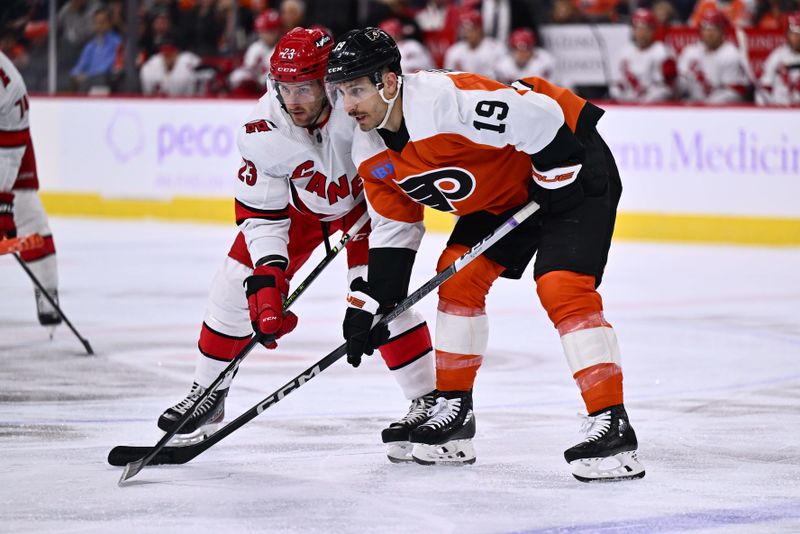 Nov 28, 2023; Philadelphia, Pennsylvania, USA; Carolina Hurricanes right wing Stefan Noesen (23) and Philadelphia Flyers right wing Garnet Hathaway (19) ready for a faceoff in the first period at Wells Fargo Center. Mandatory Credit: Kyle Ross-USA TODAY Sports