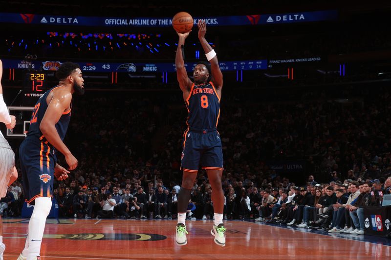 NEW YORK, NY - DECEMBER 3: OG Anunoby #8 of the New York Knicks shoots a three point basket during the game  against the Orlando Magic during the Emirates NBA Cup on December 3, 2024 at Madison Square Garden in New York City, New York.  NOTE TO USER: User expressly acknowledges and agrees that, by downloading and or using this photograph, User is consenting to the terms and conditions of the Getty Images License Agreement. Mandatory Copyright Notice: Copyright 2024 NBAE  (Photo by Nathaniel S. Butler/NBAE via Getty Images)