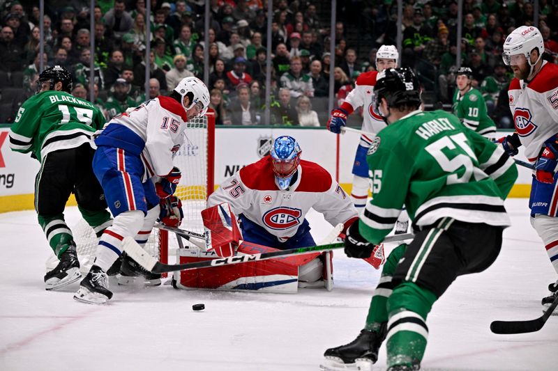 Jan 16, 2025; Dallas, Texas, USA; Montreal Canadiens goaltender Jakub Dobes (75) covers up the puck in front of Dallas Stars left wing Jamie Benn (14) and center Wyatt Johnston (53) during the second period at the American Airlines Center. Mandatory Credit: Jerome Miron-Imagn Images