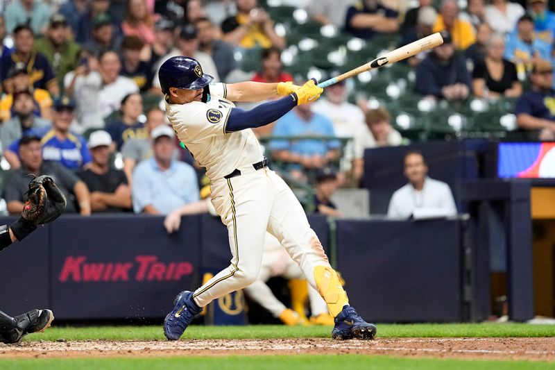 Jul 10, 2024; Milwaukee, Wisconsin, USA;  Milwaukee Brewers shortstop Willy Adames (27) hits a home run during the eighth inning against the Pittsburgh Pirates at American Family Field. Mandatory Credit: Jeff Hanisch-USA TODAY Sports