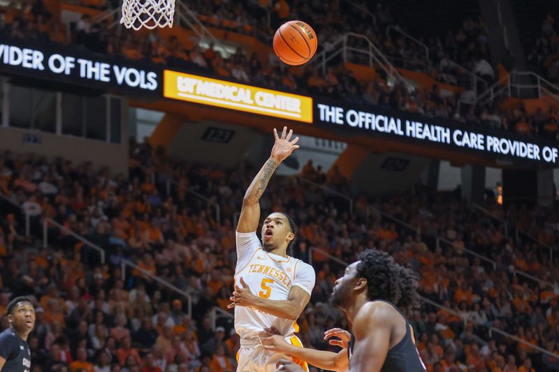 Feb 25, 2023; Knoxville, Tennessee, USA; Tennessee Volunteers guard Zakai Zeigler (5) shoots the ball against the South Carolina Gamecocks during the first half at Thompson-Boling Arena. Mandatory Credit: Randy Sartin-USA TODAY Sports