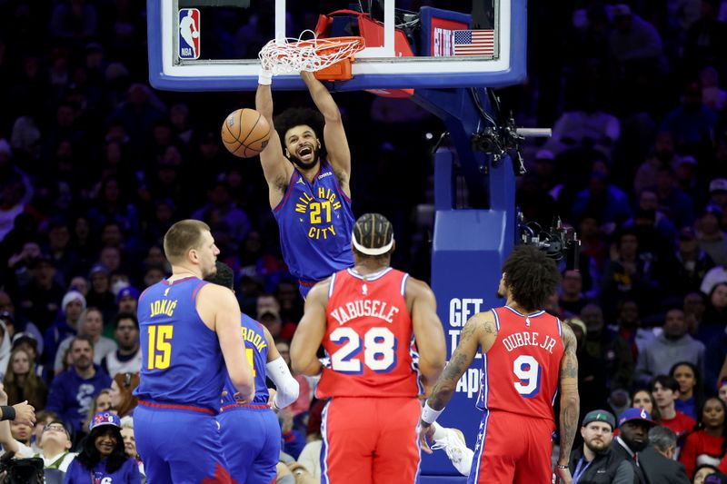 PHILADELPHIA, PENNSYLVANIA - JANUARY 31: Jamal Murray #27 of the Denver Nuggets dunks the ball during the first half against the Philadelphia 76ers at the Wells Fargo Center on January 31, 2025 in Philadelphia, Pennsylvania. NOTE TO USER: User expressly acknowledges and agrees that, by downloading and or using this photograph, User is consenting to the terms and conditions of the Getty Images License Agreement. (Photo by Emilee Chinn/Getty Images)