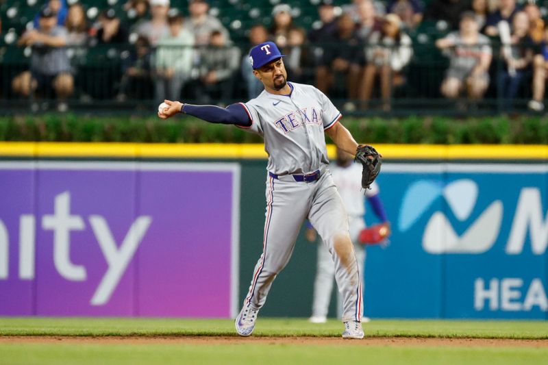 Apr 15, 2024; Detroit, Michigan, USA; Texas Rangers second baseman Marcus Semien throws to first against the Detroit Tigers at Comerica Park. Mandatory Credit: Brian Bradshaw Sevald-USA TODAY Sports