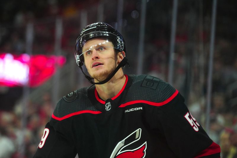 Mar 24, 2024; Raleigh, North Carolina, USA;  Carolina Hurricanes left wing Jake Guentzel (59) looks on against the Toronto Maple Leafs during the second period at PNC Arena. Mandatory Credit: James Guillory-USA TODAY Sports