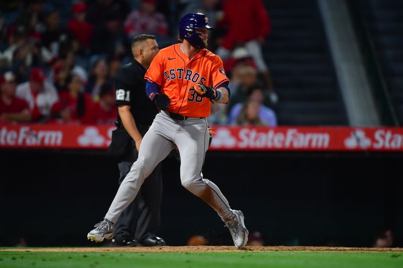 Jun 7, 2024; Anaheim, California, USA; Houston Astros outfielder Trey Cabbage (38) scores a run against the Los Angeles Angels during the seventh inning at Angel Stadium. Mandatory Credit: Gary A. Vasquez-USA TODAY Sports