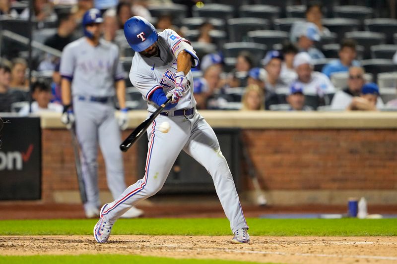 Aug 30, 2023; New York City, New York, USA;  Texas Rangers second baseman Marcus Semien (2) hits a single against the New York Mets during the eighth inning at Citi Field. Mandatory Credit: Gregory Fisher-USA TODAY Sports