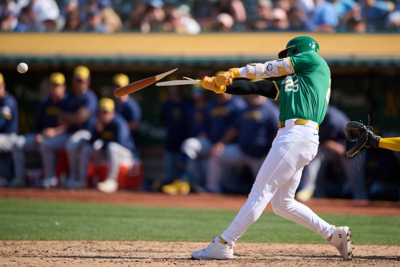 Aug 24, 2024; Oakland, California, USA; Oakland Athletics outfielder Brent Rooker (25) hits an RBI single and breaks his bat against the Milwaukee Brewers during the ninth inning at Oakland-Alameda County Coliseum. Mandatory Credit: Robert Edwards-USA TODAY Sports