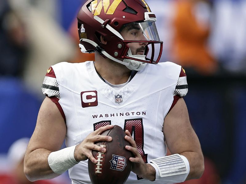 Washington Commanders quarterback Sam Howell (14) in action against the New York Giants during an NFL football game Sunday, Oct. 22, 2023, in East Rutherford, N.J. (AP Photo/Adam Hunger)