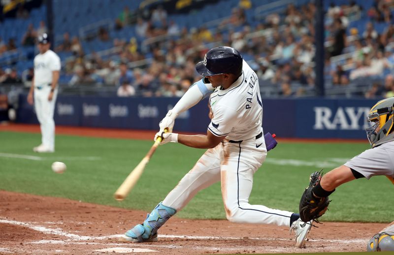 May 30, 2024; St. Petersburg, Florida, USA; Tampa Bay Rays outfielder Richie Palacios (1) hitting a walk off RBI single against the Oakland Athletics during the eleventh inning at Tropicana Field. Mandatory Credit: Kim Klement Neitzel-USA TODAY Sports