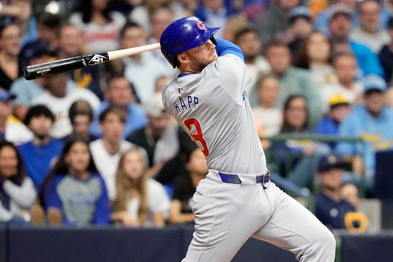 May 28, 2024; Milwaukee, Wisconsin, USA;  Chicago Cubs left fielder Ian Happ (8) hits a double during the tenth inning against the Milwaukee Brewers at American Family Field. Mandatory Credit: Jeff Hanisch-USA TODAY Sports