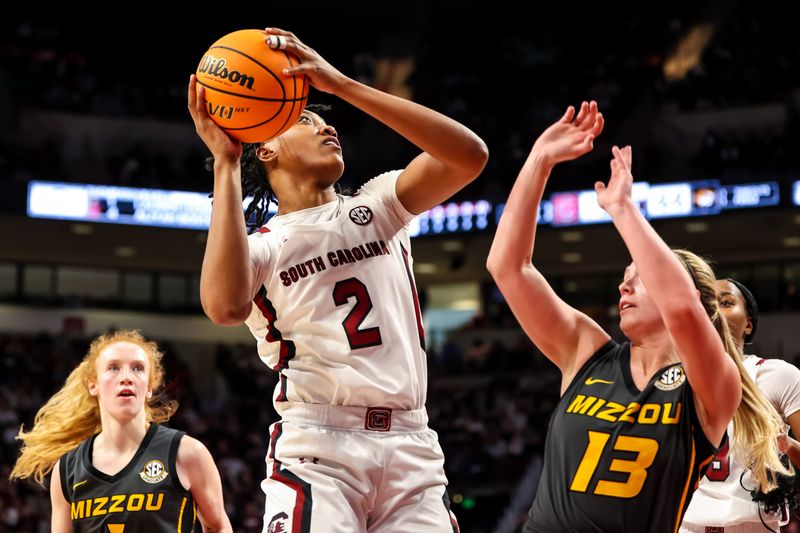 Jan 15, 2023; Columbia, South Carolina, USA; South Carolina Gamecocks forward Ashlyn Watkins (2) shoots over Missouri Tigers guard Haley Troup (13) in the second half at Colonial Life Arena. Mandatory Credit: Jeff Blake-USA TODAY Sports