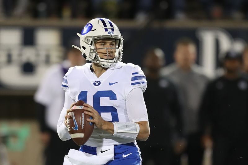 Oct 1, 2021; Logan, Utah, USA; Brigham Young Cougars quarterback Baylor Romney (16) looks to pass the ball during the second quarter against the Utah State Aggies at Merlin Olsen Field at Maverik Stadium. Mandatory Credit: Rob Gray-USA TODAY Sports