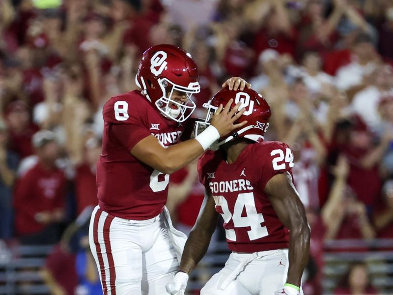 Sep 24, 2022; Norman, Oklahoma, USA;  Oklahoma Sooners quarterback Dillon Gabriel (8) celebrates with Oklahoma Sooners running back Marcus Major (24) after throwing a touchdown pass during the first half against the Kansas State Wildcats at Gaylord Family-Oklahoma Memorial Stadium. Mandatory Credit: Kevin Jairaj-USA TODAY Sports