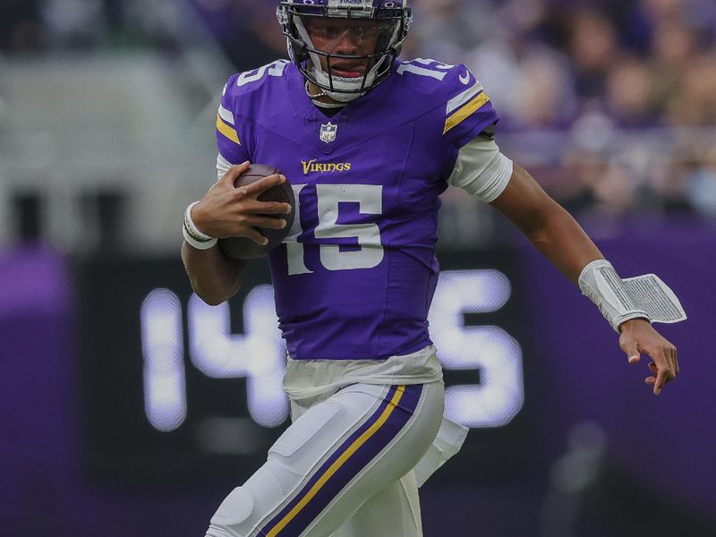 Minnesota Vikings quarterback Joshua Dobbs (15) carries the ball during the first half of an NFL football game against the New Orleans Saints, Sunday, Nov. 12, 2023 in Minneapolis. (AP Photo/Stacy Bengs)