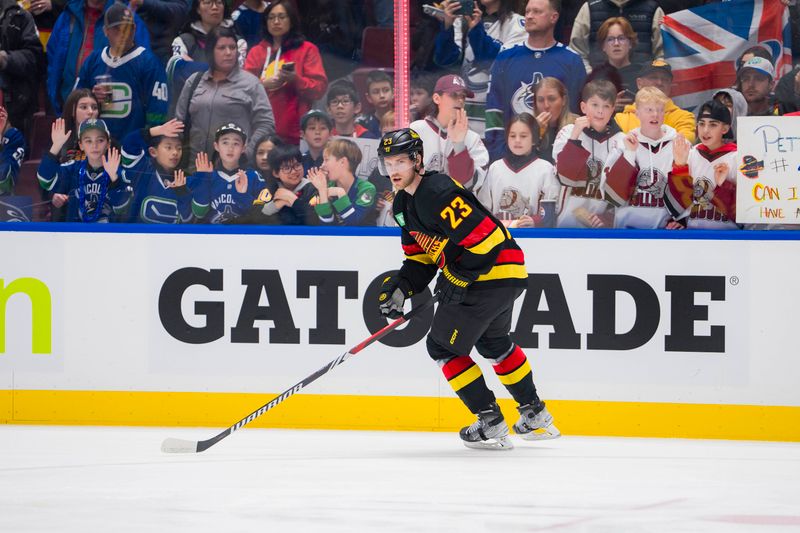 Feb 15, 2024; Vancouver, British Columbia, CAN; Vancouver Canucks forward Elias Lindholm (23) skates during warm up prior to a game against the Detroit Red Wings at Rogers Arena.  Mandatory Credit: Bob Frid-USA TODAY Sports