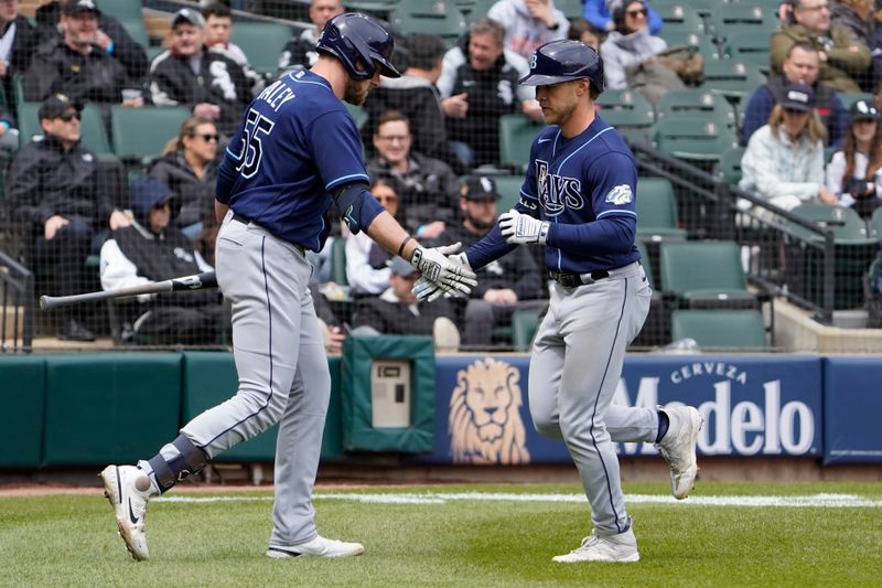 Apr 30, 2023; Chicago, Illinois, USA; Tampa Bay Rays shortstop Taylor Walls (6) is greeted by first baseman Luke Raley (55) after hitting a home run against the Chicago White Sox during the fourth inning at Guaranteed Rate Field. Mandatory Credit: David Banks-USA TODAY Sports