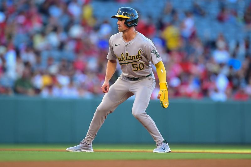 Jun 25, 2024; Anaheim, California, USA; Oakland Athletics third baseman Armando Alvarez (50) leads off from second against the Los Angeles Angels during the third inning at Angel Stadium. Mandatory Credit: Gary A. Vasquez-USA TODAY Sports