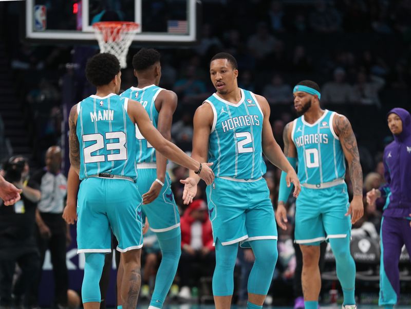 CHARLOTTE, NC - APRIL 5:  Grant Williams #2 and Tre Mann #23 of the Charlotte Hornets high five before the game against the Orlando Magic on April 5, 2024 at Spectrum Center in Charlotte, North Carolina. NOTE TO USER: User expressly acknowledges and agrees that, by downloading and or using this photograph, User is consenting to the terms and conditions of the Getty Images License Agreement.  Mandatory Copyright Notice:  Copyright 2024 NBAE (Photo by Brock Williams-Smith/NBAE via Getty Images)