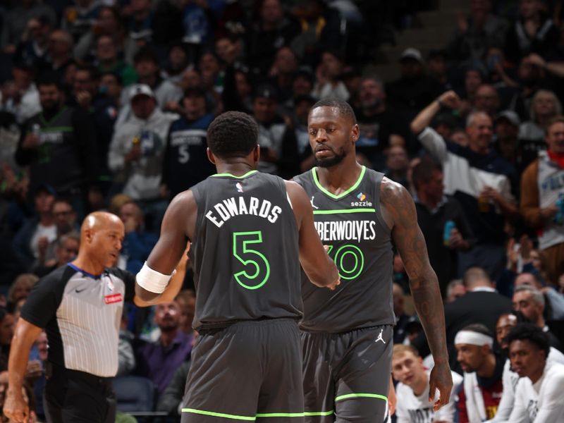 MINNEAPOLIS, MN -  NOVEMBER 1: Julius Randle #30 of the Minnesota Timberwolves high fives Anthony Edwards #5 during the game against the Denver Nuggets on November 1, 2024 at Target Center in Minneapolis, Minnesota. NOTE TO USER: User expressly acknowledges and agrees that, by downloading and or using this Photograph, user is consenting to the terms and conditions of the Getty Images License Agreement. Mandatory Copyright Notice: Copyright 2024 NBAE (Photo by David Sherman/NBAE via Getty Images)