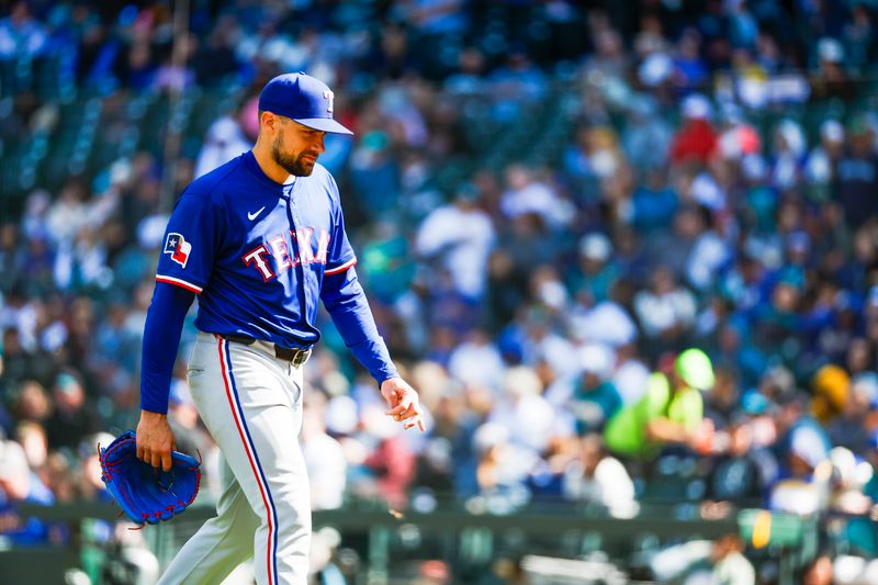 Apr 13, 2025; Seattle, Washington, USA; Texas Rangers pitcher Nathan Eovaldi (17) walks to the dugout during a sixth inning pitching change against the Seattle Mariners at T-Mobile Park. Mandatory Credit: Joe Nicholson-Imagn Images