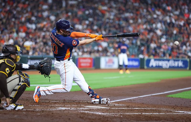 Sep 10, 2023; Houston, Texas, USA; Houston Astros center fielder Chas McCormick (20) hits a single during the third inning against the San Diego Padres at Minute Maid Park. Mandatory Credit: Troy Taormina-USA TODAY Sports