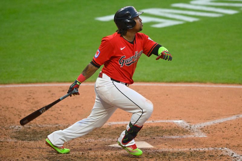 Aug 5, 2024; Cleveland, Ohio, USA; Cleveland Guardians third baseman Jose Ramirez (11) singles in the sixth inning against the Arizona Diamondbacks at Progressive Field. Mandatory Credit: David Richard-USA TODAY Sports