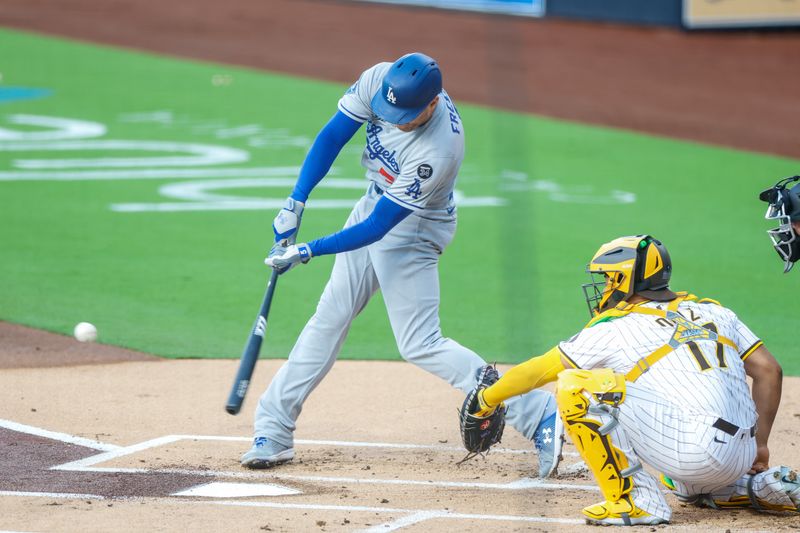 Jun 9, 2025; San Diego, California, USA; Los Angeles Dodgers first baseman Freddie Freeman (5) hits an RBI  double during the first inning against the San Diego Padres at Petco Park. Mandatory Credit: David Frerker-Imagn Images