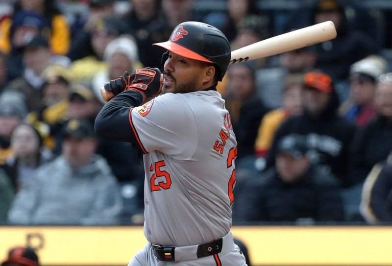 Apr 5, 2024; Pittsburgh, Pennsylvania, USA;  Baltimore Orioles right fielder Anthony Santander (25) hits a double against the Pittsburgh Pirates during the seventh inning at PNC Park. Mandatory Credit: Charles LeClaire-USA TODAY Sports