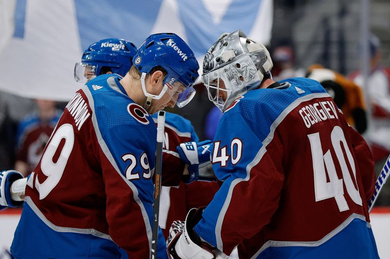 Mar 22, 2024; Denver, Colorado, USA; Colorado Avalanche center Nathan MacKinnon (29) with goaltender Alexandar Georgiev (40) after the game against the Columbus Blue Jackets at Ball Arena. Mandatory Credit: Isaiah J. Downing-USA TODAY Sports