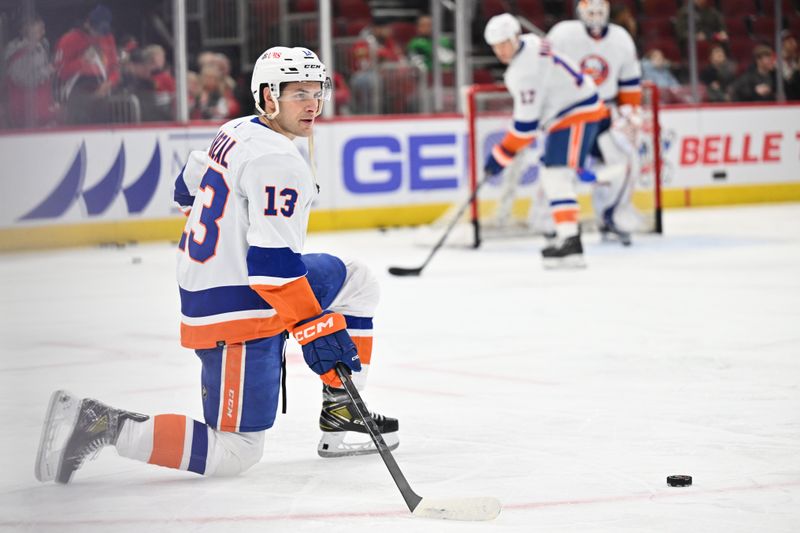 Jan 19, 2024; Chicago, Illinois, USA;  New York Islanders forward Mathew Barzal (13) stretches on the ice before a game against the Chicago Blackhawks at United Center. Mandatory Credit: Jamie Sabau-USA TODAY Sports