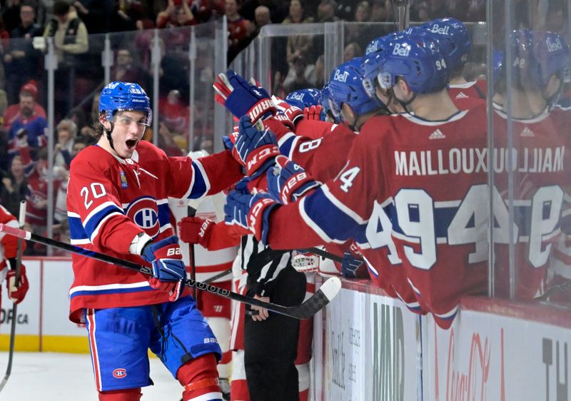 Apr 16, 2024; Montreal, Quebec, CAN; Montreal Canadiens forward Juraj Slafkovsky (20) celebrates with teammates after scoring a goal against the Detroit Red Wings during the third period at the Bell Centre. Mandatory Credit: Eric Bolte-USA TODAY Sports