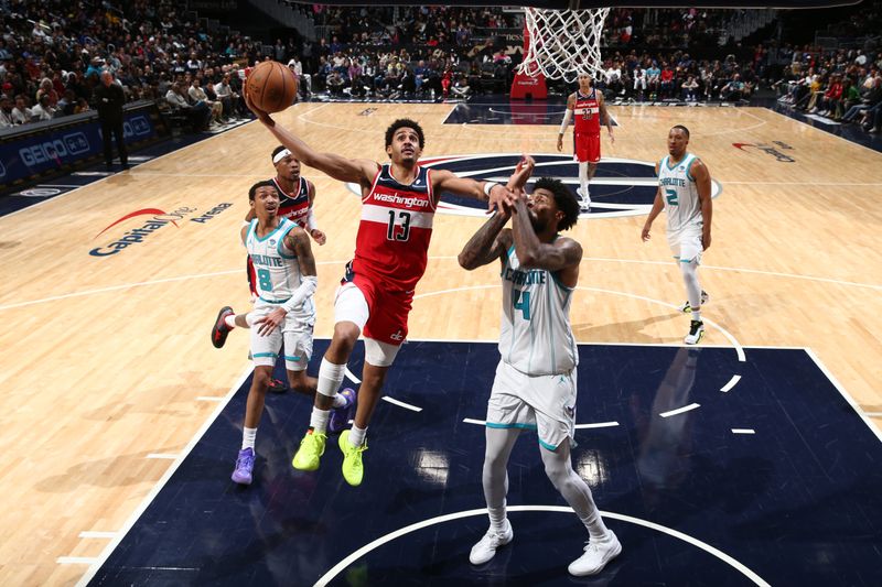 WASHINGTON, DC -? MARCH 8: Jordan Poole #13 of the Washington Wizards drives to the basket during the game against the Charlotte Hornets on March 8, 2024 at Capital One Arena in Washington, DC. NOTE TO USER: User expressly acknowledges and agrees that, by downloading and or using this Photograph, user is consenting to the terms and conditions of the Getty Images License Agreement. Mandatory Copyright Notice: Copyright 2024 NBAE (Photo by Kenny Giarla/NBAE via Getty Images)