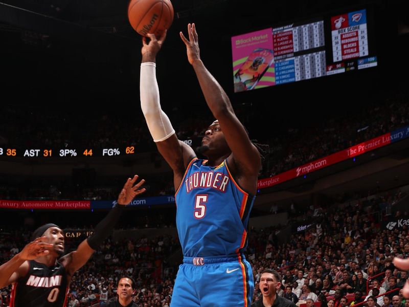 MIAMI, FL - JANUARY 10: Luguentz Dort #5 of the Oklahoma City Thunder shoots the ball during the game against the Miami Heat on January 10, 2023 at Kaseya Center in Miami, Florida. NOTE TO USER: User expressly acknowledges and agrees that, by downloading and or using this Photograph, user is consenting to the terms and conditions of the Getty Images License Agreement. Mandatory Copyright Notice: Copyright 2023 NBAE (Photo by Issac Baldizon/NBAE via Getty Images)