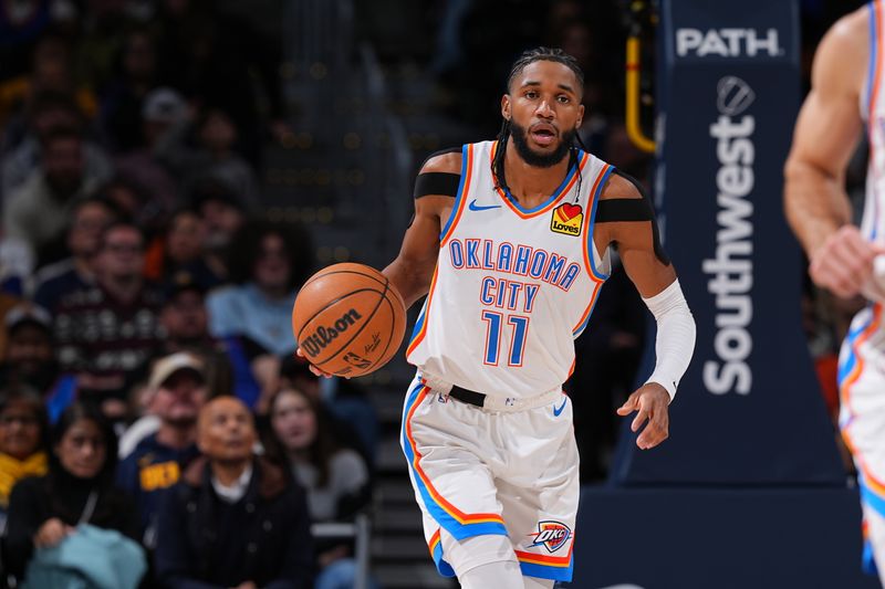 DENVER, CO - NOVEMBER 6:  Isaiah Joe #11 of the Oklahoma City Thunder dribbles the ball during the game against the Denver Nuggets  during a regular season game on November 6, 2024 at Ball Arena in Denver, Colorado. NOTE TO USER: User expressly acknowledges and agrees that, by downloading and/or using this Photograph, user is consenting to the terms and conditions of the Getty Images License Agreement. Mandatory Copyright Notice: Copyright 2024 NBAE (Photo by Bart Young/NBAE via Getty Images)