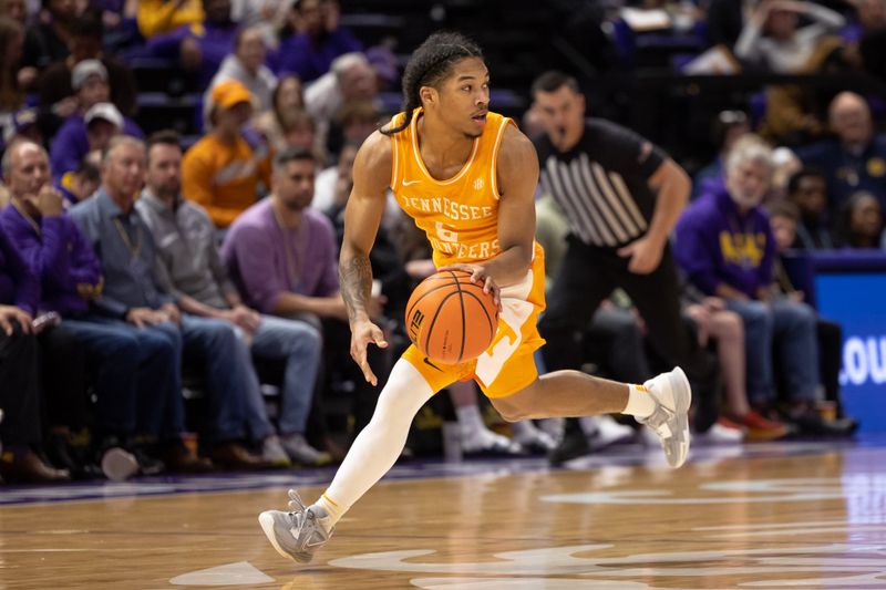 Jan 21, 2023; Baton Rouge, Louisiana, USA;  Tennessee Volunteers guard Zakai Zeigler (5) dribbles the ball against the LSU Tigers during the second half at Pete Maravich Assembly Center. Mandatory Credit: Stephen Lew-USA TODAY Sports