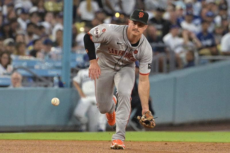 Jul 24, 2024; Los Angeles, California, USA;  San Francisco Giants third baseman Matt Chapman (26) throw Los Angeles Dodgers catcher Will Smith (16) out at first in the third inning at Dodger Stadium. Mandatory Credit: Jayne Kamin-Oncea-USA TODAY Sports