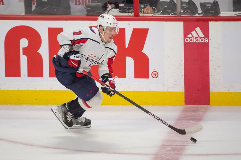 Oct 20, 2022; Ottawa, Ontario, CAN; Washington Capitals defenseman Dmitry Orlov (9) skates with the puck in the third period against the Ottawa Senators at the Canadian Tire Centre. Mandatory Credit: Marc DesRosiers-USA TODAY Sports