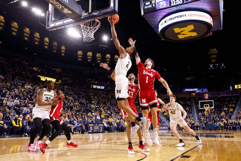 Feb 8, 2023; Ann Arbor, Michigan, USA;  Michigan Wolverines guard Kobe Bufkin (2) shoots on Nebraska Cornhuskers guard Sam Hoiberg (1) in the first half at Crisler Center. Mandatory Credit: Rick Osentoski-USA TODAY Sports