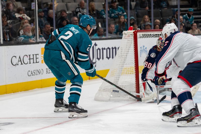 Nov 5, 2024; San Jose, California, USA;  Columbus Blue Jackets goaltender Elvis Merzlikins (90) makes a save against San Jose Sharks center Will Smith (2) during the second period at SAP Center at San Jose. Mandatory Credit: Neville E. Guard-Imagn Images