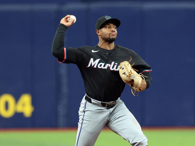 Jul 31, 2024; St. Petersburg, Florida, USA;  Miami Marlins shortstop Xavier Edwards (63) throws the ball to first base for an out against the Tampa Bay Rays during the ninth inning at Tropicana Field. Mandatory Credit: Kim Klement Neitzel-USA TODAY Sports