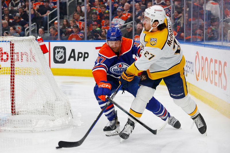 Jan 27, 2024; Edmonton, Alberta, CAN; Nashville Predators defensemen Ryan McDonagh (27) clears there puck in front of Edmonton Oilers forward Warren Foegele (37) during the first period at Rogers Place. Mandatory Credit: Perry Nelson-USA TODAY Sports