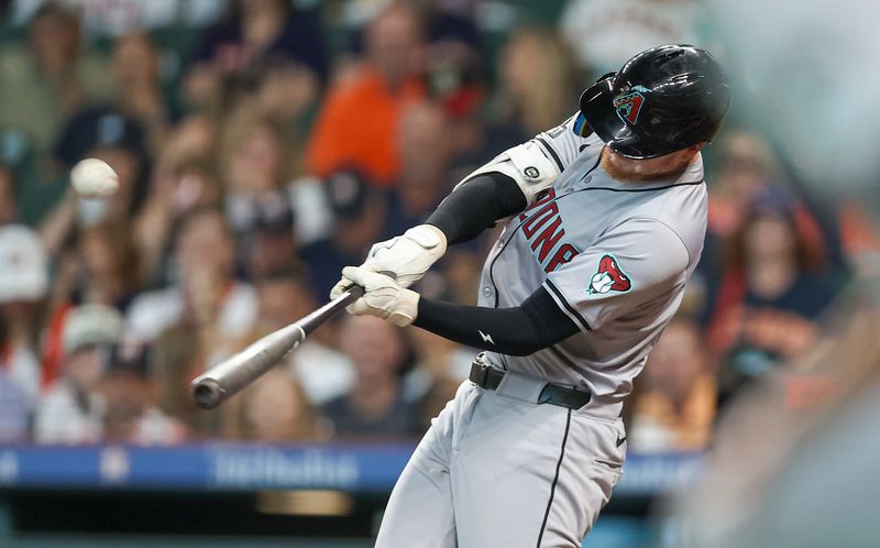 Sep 8, 2024; Houston, Texas, USA; Arizona Diamondbacks left fielder Pavin Smith (26) hits a home run during the second inning against the Houston Astros at Minute Maid Park. Mandatory Credit: Troy Taormina-Imagn Images