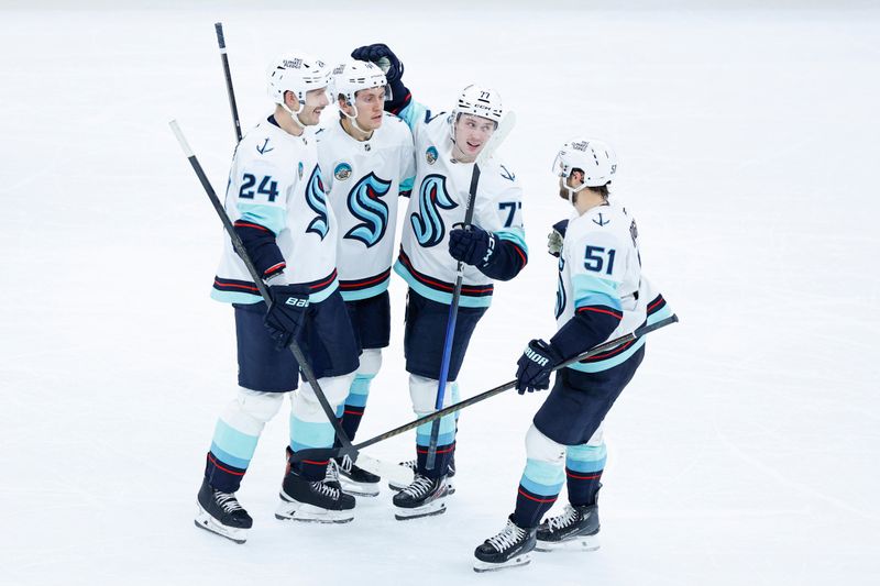 Nov 20, 2025; Chicago, Illinois, USA; Seattle Kraken center Shane Wright (51) celebrates with teammates after scoring against the Chicago Blackhawks during the third period at United Center. Mandatory Credit: Kamil Krzaczynski-Imagn Images