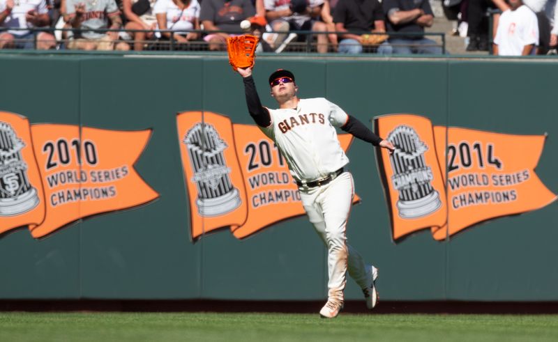 Jul 30, 2023; San Francisco, California, USA; San Francisco Giants left fielder Joc Pederson (23) makes a running catch of a fly ball by Boston Red Sox right fielder Alex Verdugo during the 11th inning at Oracle Park. Mandatory Credit: D. Ross Cameron-USA TODAY Sports