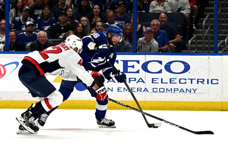 Mar 30, 2023; Tampa, Florida, USA; Tampa Bay Lightning right wing Nikita Kucherov (86) attempts to get past Washington Capitals defensemen Martin Fehervary (42) in the first period at Amalie Arena. Mandatory Credit: Jonathan Dyer-USA TODAY Sports