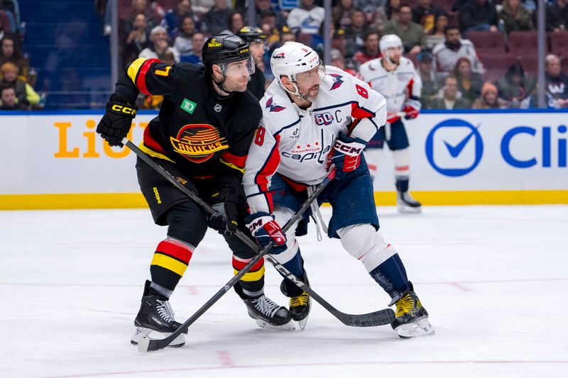 Jan 25, 2025; Vancouver, British Columbia, CAN; Vancouver Canucks defenseman Carson Soucy (7) battles with Washington Capitals forward Alex Ovechkin (8) in the third period at Rogers Arena. Mandatory Credit: Bob Frid-Imagn Images