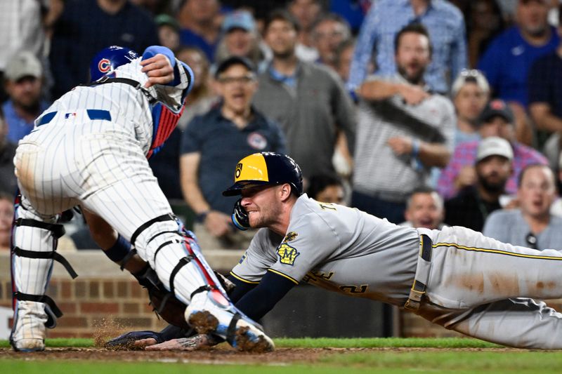 Aug 19, 2025; Chicago, Illinois, USA;  Milwaukee Brewers second baseman Brice Turang (2) is tagged out at home by Chicago Cubs catcher Carson Kelly (15) during the seventh inning at Wrigley Field. Mandatory Credit: Matt Marton-Imagn Images