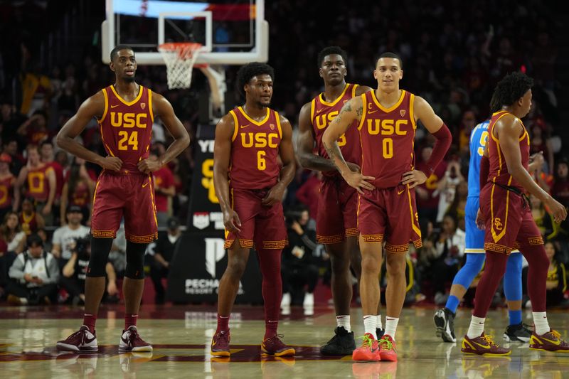 Jan 27, 2024; Los Angeles, California, USA; Southern California Trojans forward Joshua Morgan (24), guard Bronny James (6), forward Kijani Wright (33) and guard Kobe Johnson (0) react against the UCLA Bruins in the first half at Galen Center. Mandatory Credit: Kirby Lee-USA TODAY Sports